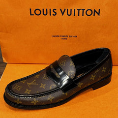 Louis Vuitton loafer on an orange background with brand name displayed