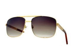 Gold-framed sunglasses with gradient lenses on a white background
