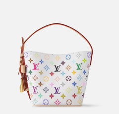 Designer handbag with colorful monogram pattern on a light gray background