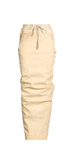 Beige drawstring pants with a relaxed, slightly wrinkled fit, shown against a plain white background.
