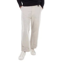 Beige pants worn by a person on a white background