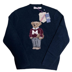 Navy blue sweater with a bear graphic and Polo Ralph Lauren tag on a textured white background
