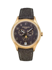 Watch with gold case and dark strap in a box