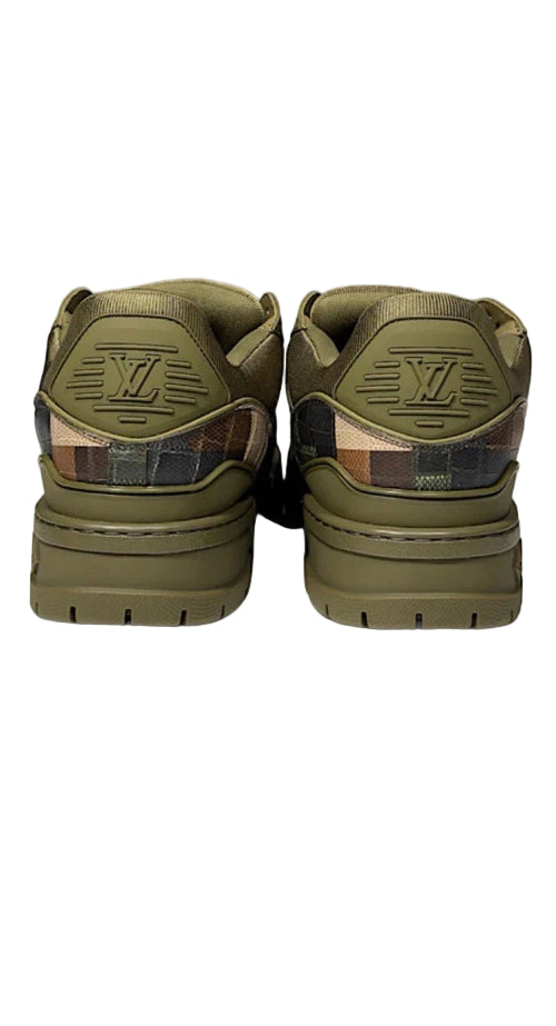 Pair of green sneakers with a brand logo on a white background