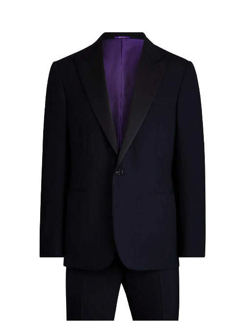 A dark navy blue suit jacket with black satin peak lapels and a vibrant purple satin inner lining, displayed on a clean white background.