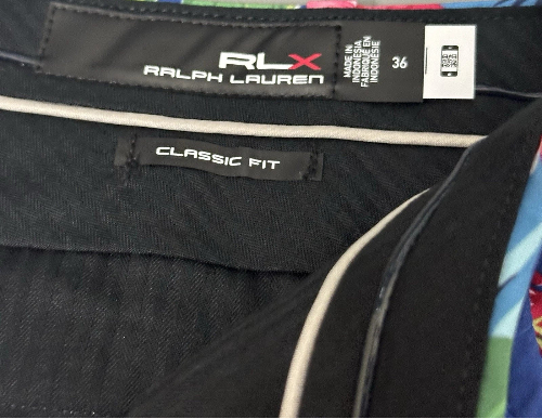 Close-up of Ralph Lauren RLX label on a garment with colorful lining.