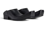 Black sandal with a unique design on a white background