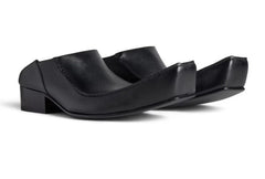 Black sandal with a unique design on a white background