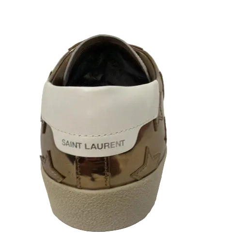 Saint Laurent sneaker with gold and white design on a white background