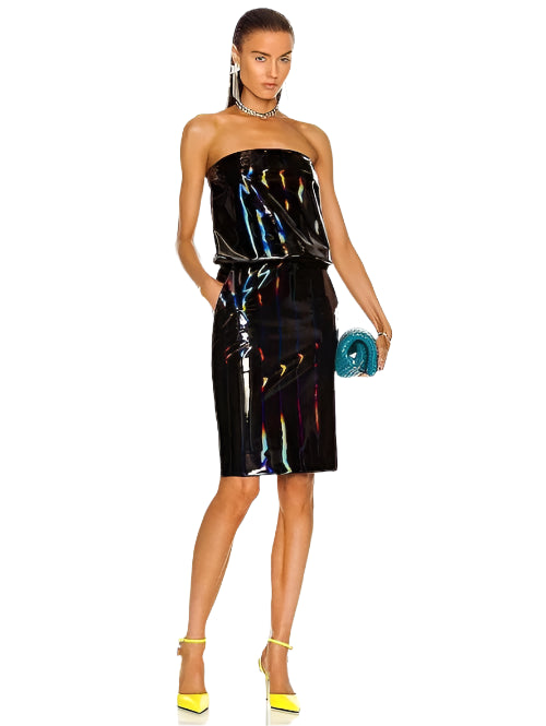 Woman wearing a strapless, reflective black dress with colorful highlights on a white background.