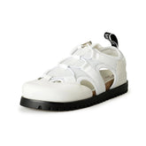 White sandal with black sole on a white background