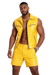 Man wearing a yellow sleeveless shirt and shorts set with a black background