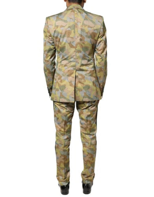 Back view of a person wearing a camouflage suit on a white background.