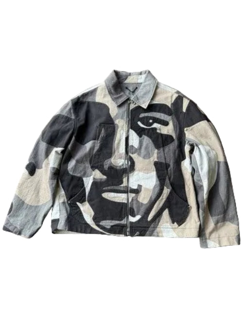 Camouflage jacket with face design on a wooden floor