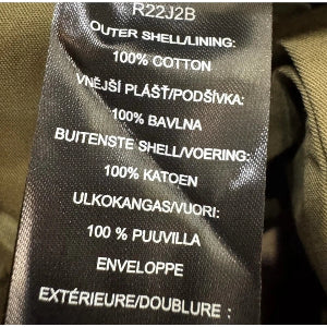 Text label on a product with material information in multiple languages.