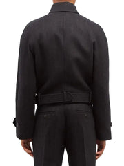 Rear view of a model wearing a dark charcoal gray belted jacket and matching trousers against a plain white background.