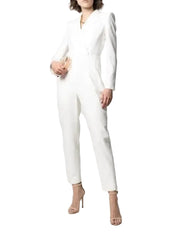 Person wearing a white jumpsuit on a plain background