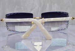 Sunglasses with a white frame and blue lenses on a reflective surface.