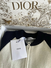 Dior sweater with a Dior tag on a decorative box