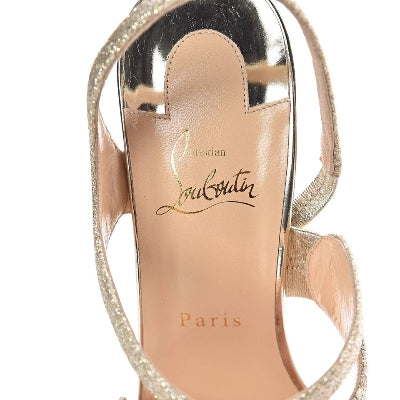 Close-up of a high-heeled shoe with 'Louis Vuitton' branding on a white background