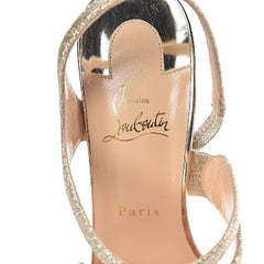 Close-up of a high-heeled shoe with 'Louis Vuitton' branding on a white background