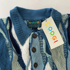 Blue knitted cardigan with a visible brand tag on a neutral background
