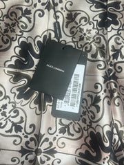 Dolce & Gabbana tag on a patterned fabric background