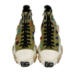 Pair of green sneakers with colorful speckles on a white background