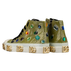 Green high-top sneakers with colorful gemstones and gold accents on a white background