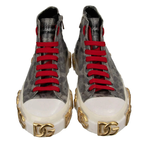 Gray high-top sneakers with red laces and gold accents on a white background