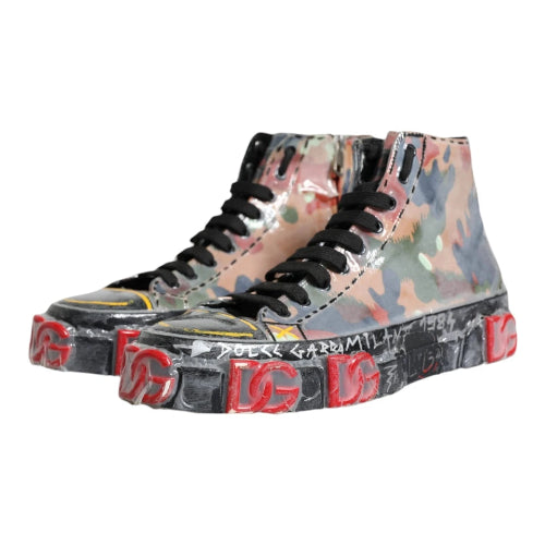 High-top sneakers with camouflage pattern and brand logo on a white background