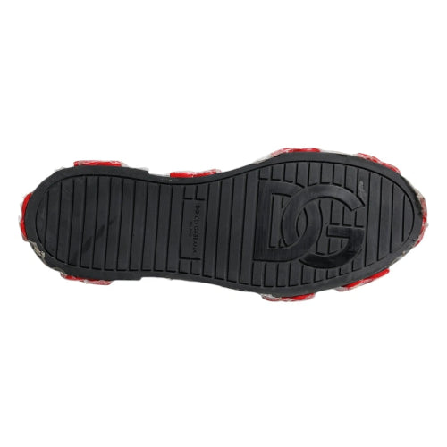 Black sole of a shoe with red accents on a white background