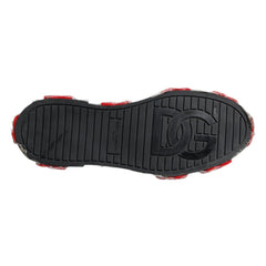 Black sole of a shoe with red accents on a white background