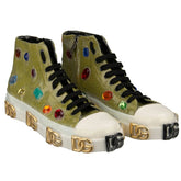 Gold high-top sneakers with colorful embellishments and brand logos on a white background
