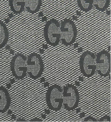 Patterned fabric with a repeated logo design on a gray background