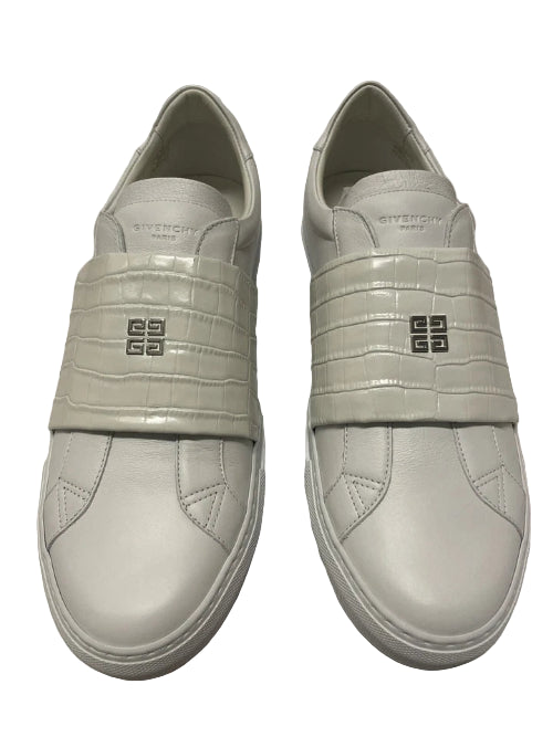 Pair of light gray sneakers with a brand logo on a light gray background