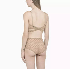 Beige lingerie set on a white background