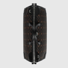 Black suitcase with a pattern on a light gray background