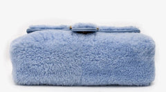 Blue fluffy bag on a white background