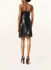 Black leather dress with lace details on a white background