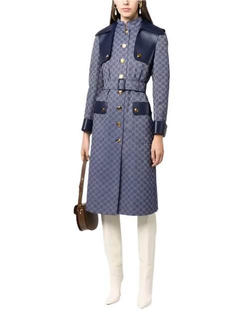 Person wearing a patterned coat with navy accents on a white background