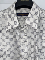 Louis Vuitton shirt with black pattern on a hanger