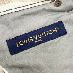 Louis Vuitton label on a gray fabric background