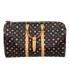 Black handbag with colorful star patterns on a dark background