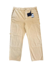 Beige pants with a tag on a white background