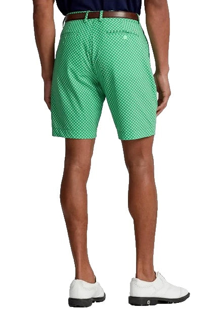 Green patterned shorts worn by a person on a white background