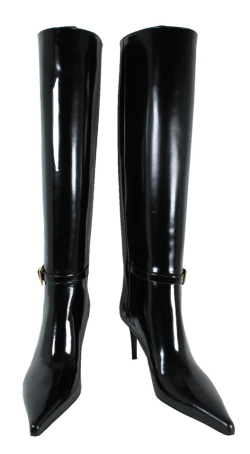 Black patent leather knee-high boots on a white background