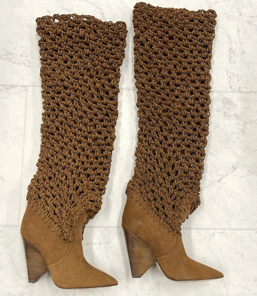 Brown knee-high boots with textured leg warmers on a white background