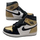 High-top sneakers with gold, black, and white design on a white background