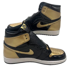 High-top sneakers with gold and black design on a white background